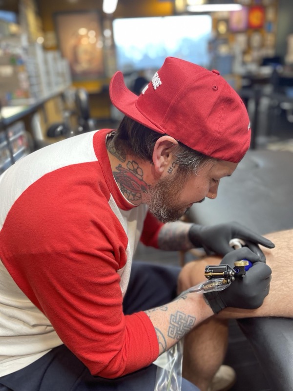 Portrait of Roo Miller, tattoo artist